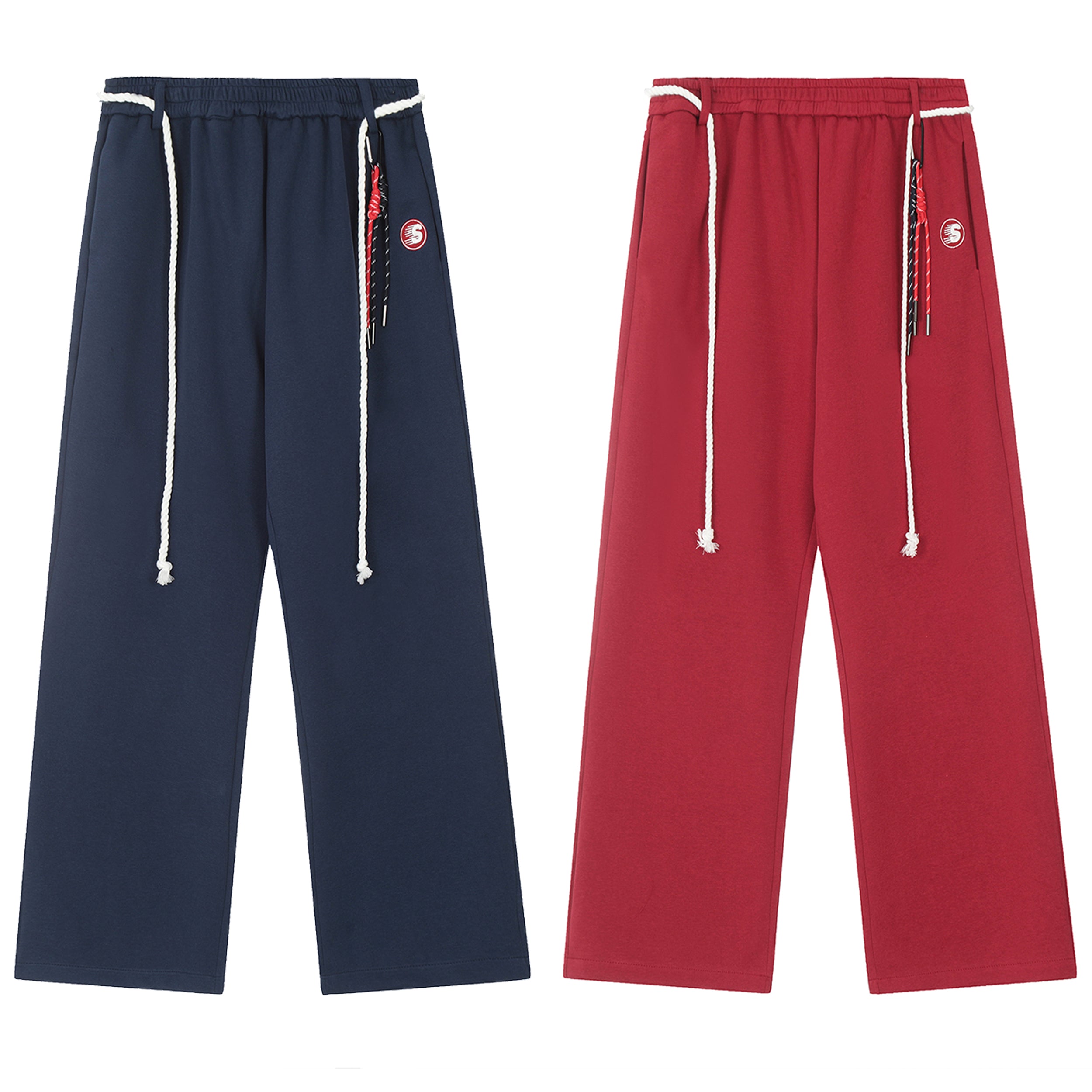 Navy and red wide-leg rope-waist sweatpants with braided drawcord and embroidered badge, flat lay on white background