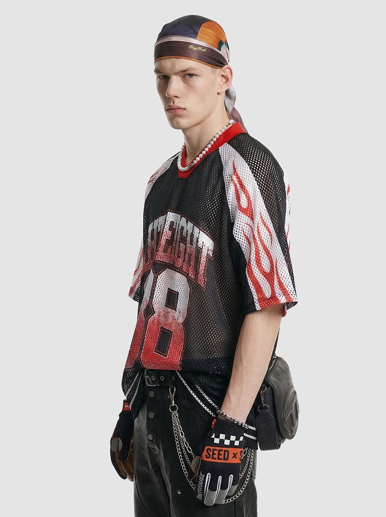 Black mesh streetwear jersey T-shirt with red flame sleeves and bold College 88 graphic on a male model