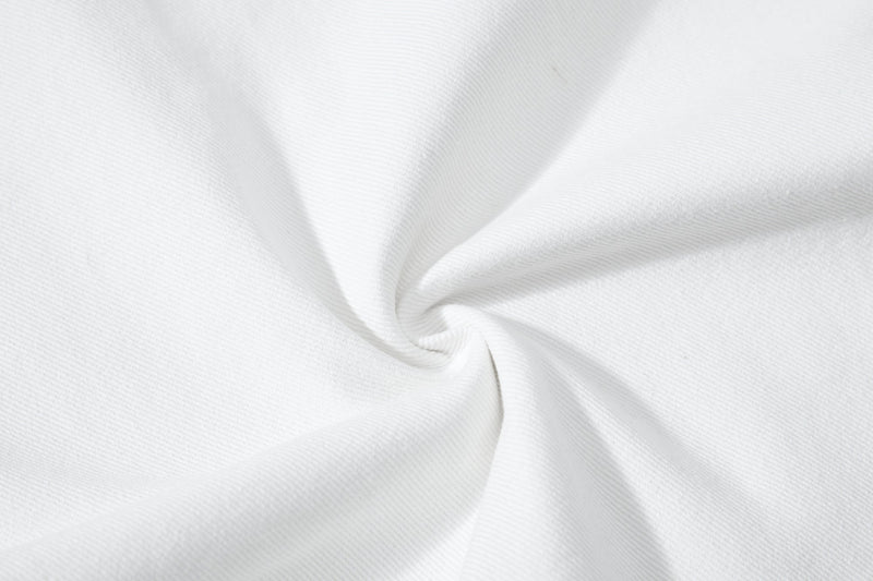 Close-up of white fabric texture with gathered fold detail