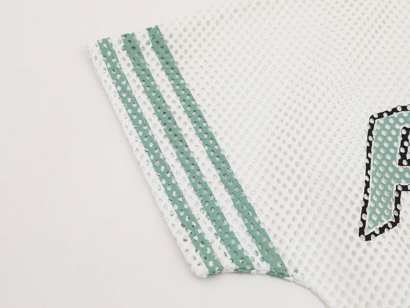 White mesh jersey tee with mint green varsity stripes and black outlined graphic detail on the sleeve