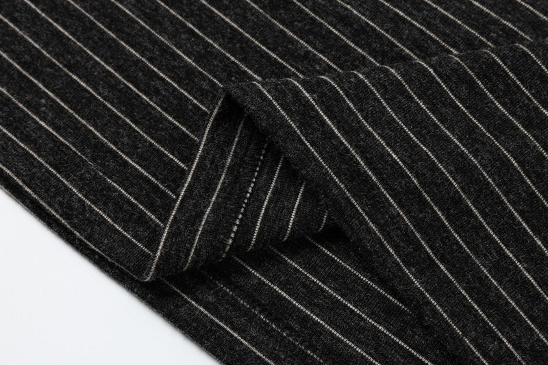 Black striped streetwear tee with a soft textured knit and visible sleeve detail in a close-up product shot