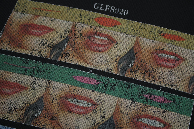 Seakoff graphic tee with collage-style red lips and distressed retro pop art print on black fabric