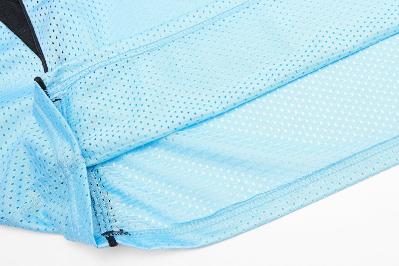Light blue perforated mesh jersey fabric with black trim and stitched seams for sporty streetwear styling