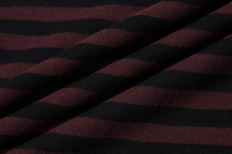 Close-up of black and burgundy striped knit tee fabric with a gothic streetwear look