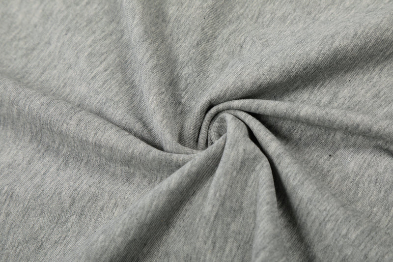 Close-up of gray tee fabric texture with folded drape