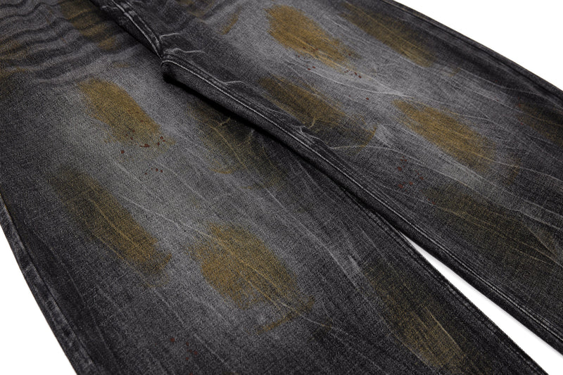 Close-up of wide-leg denim front with faded wash pattern