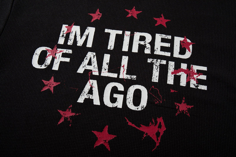 Black distressed ringer T-shirt graphic with bold white I’M TIRED OF ALL THE AGO text and red stars