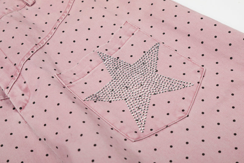 Close-up of rhinestone star patch on the back pocket of pink polka dot pants