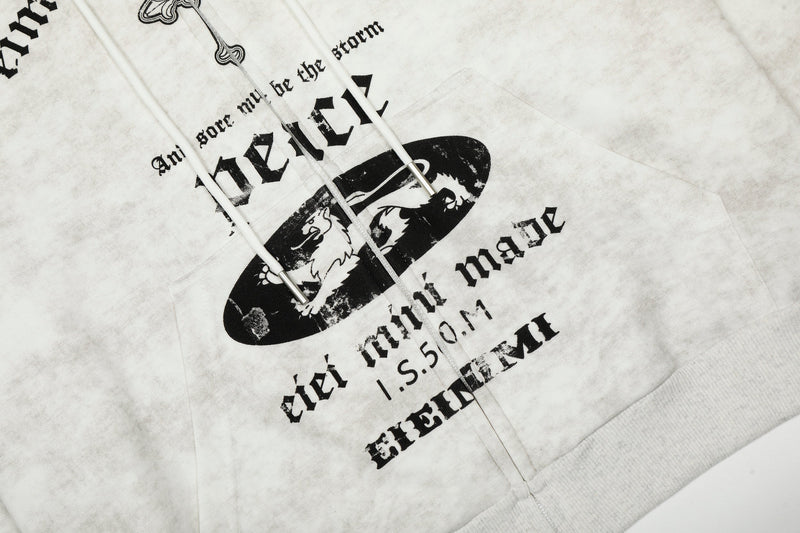 Close-up of front pocket area showing black oval graphic, lettering, and white drawstrings