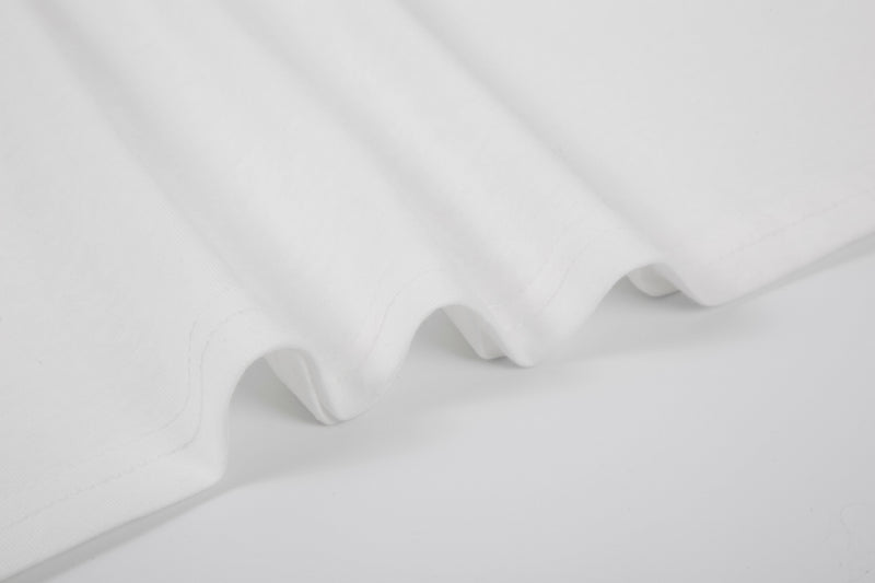 Close-up of white tee hem and fabric texture