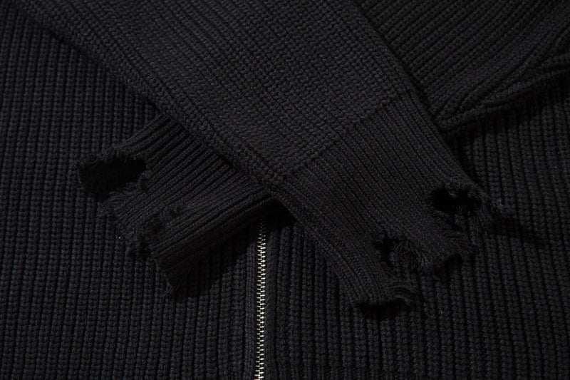 Black ribbed knit cardigan sleeve crossing over the front zipper
