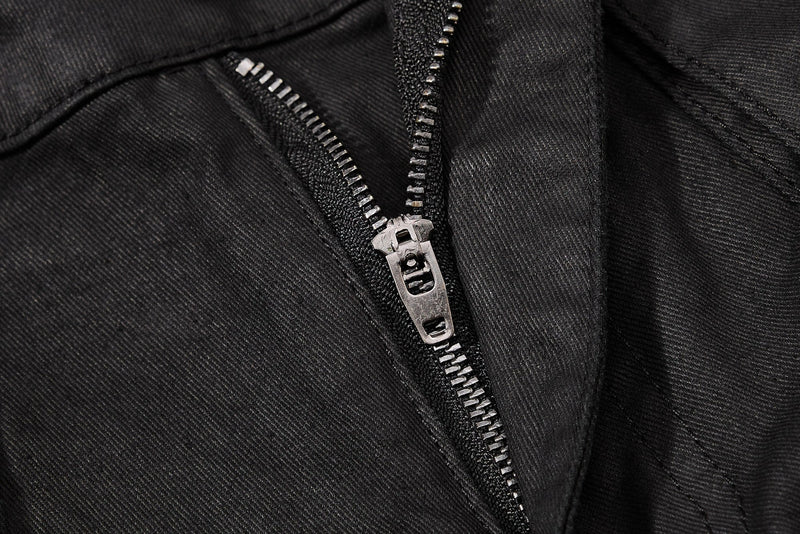 Close-up of black zipper fly on cargo shorts