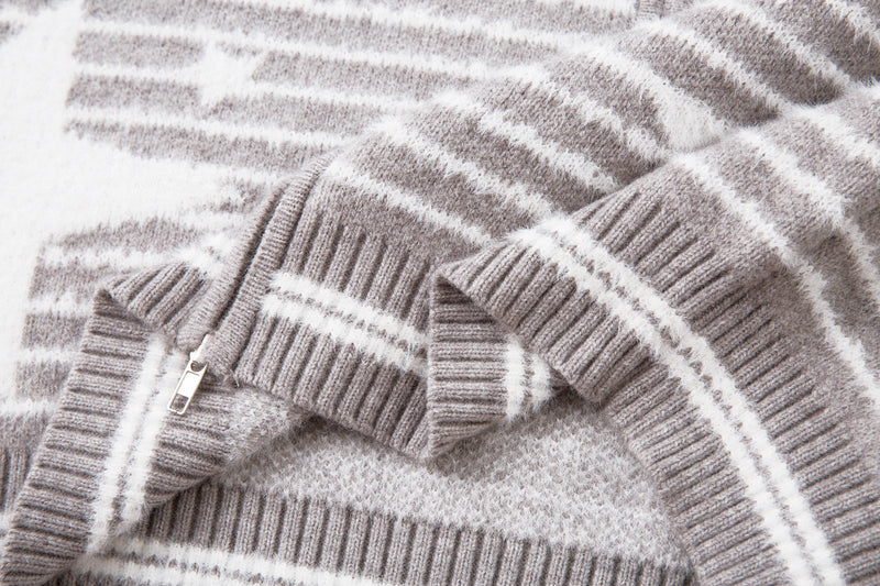 Close-up of the lower sleeve and side seam on the gray striped knit jacket