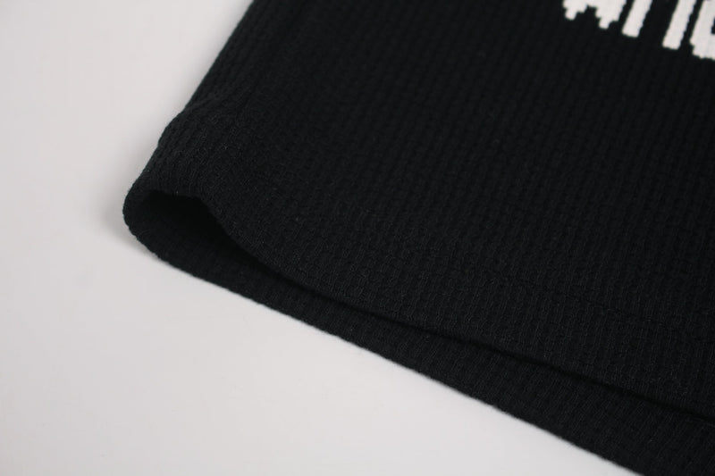 Black ribbed streetwear T-shirt with cropped glitch cat graphic on the chest
