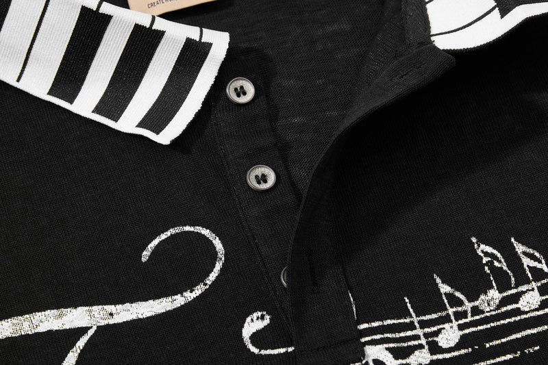 Black men’s polo shirt with white striped collar and music script graphics, vintage streetwear style