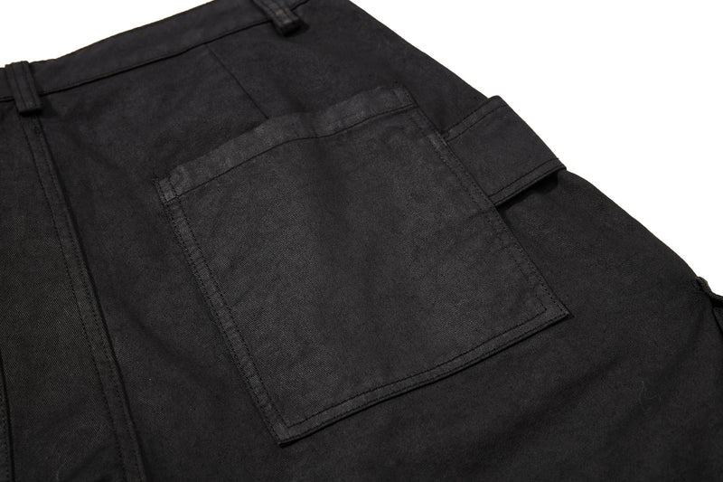 Close-up of black back patch pocket with wide-leg cargo shorts