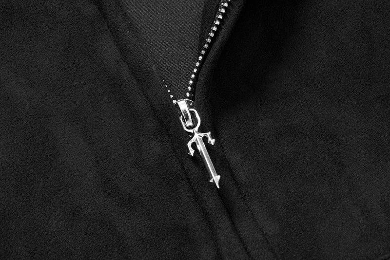 Close-up of black hoodie front zipper with silver pull and soft suede texture