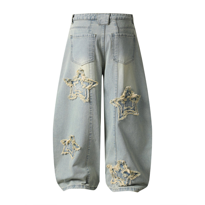 Back view of light wash baggy jeans with star patch accents and large back pockets