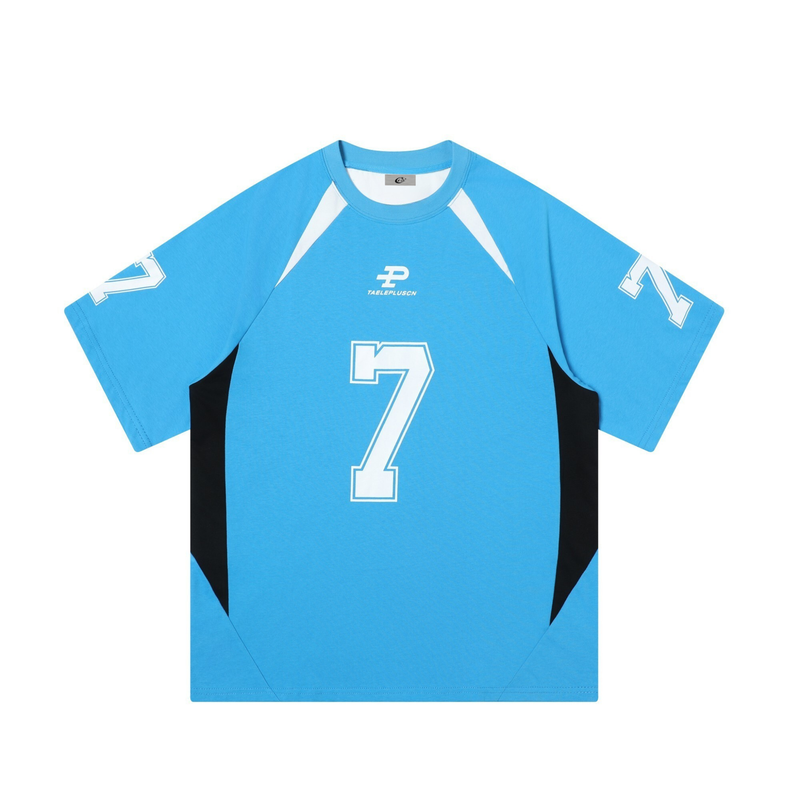 Light blue varsity jersey tee with black side panels and a large white number 7 on the front