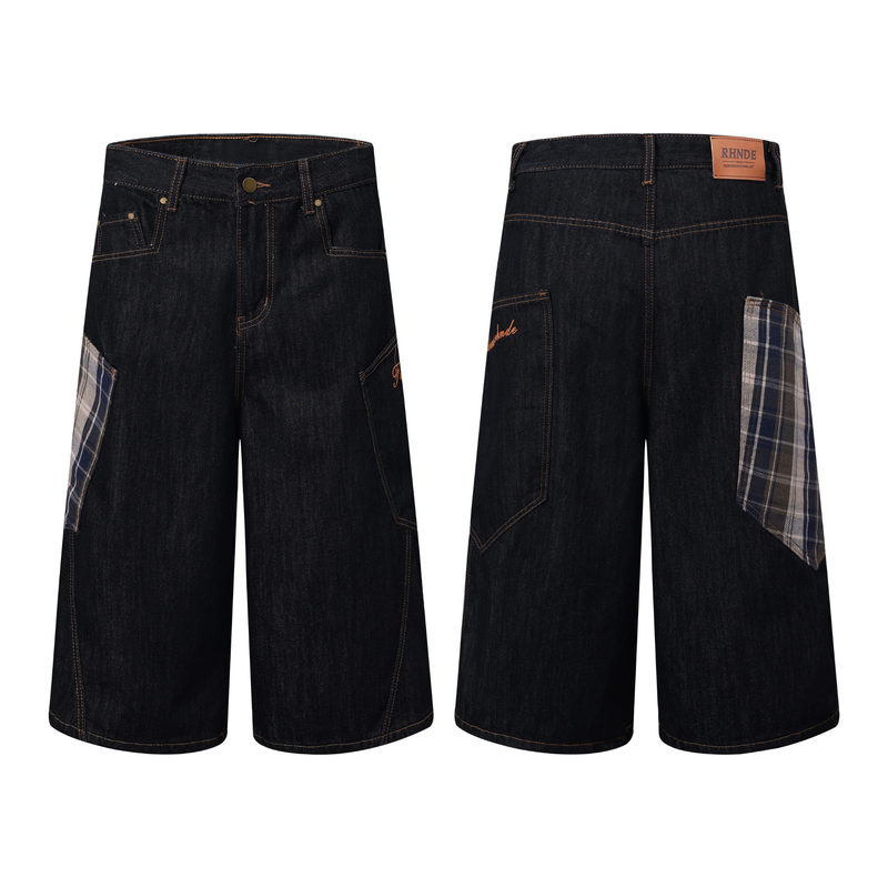 Front and back views of dark indigo wide-leg denim jorts with plaid patchwork details