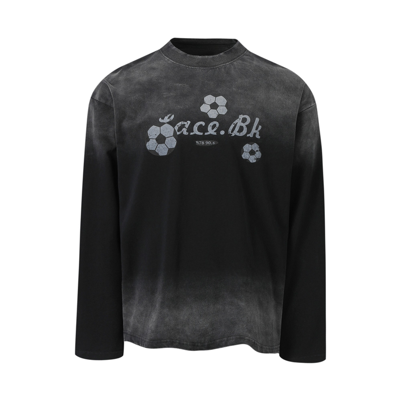 Black long-sleeve tee front view with soccer ball graphics and distressed text print