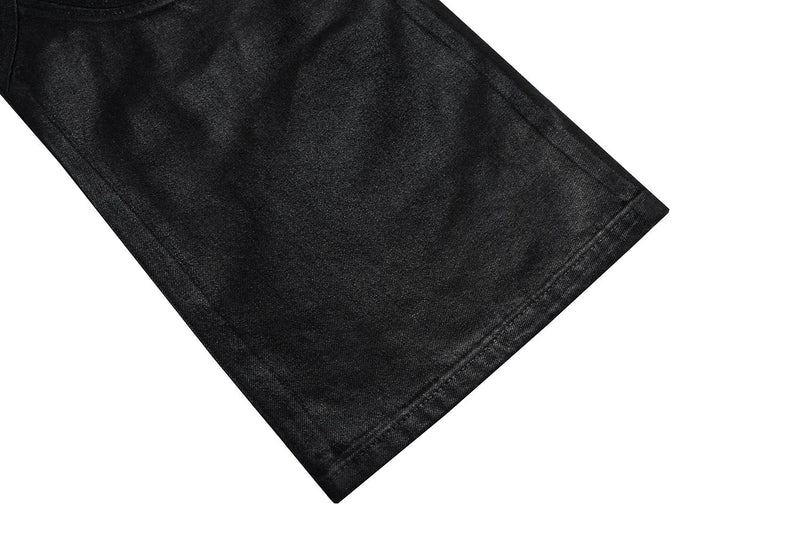 Close-up of black pants hem with straight stitched edge