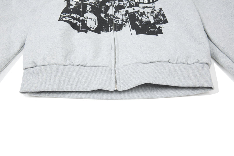 Close-up of light gray hoodie hem and lower front zipper