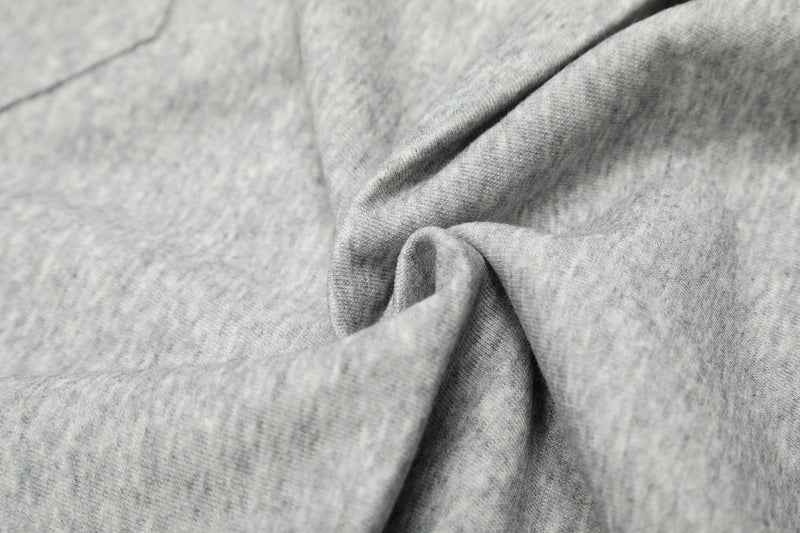 Close-up of gray cotton fabric texture with soft heathered finish