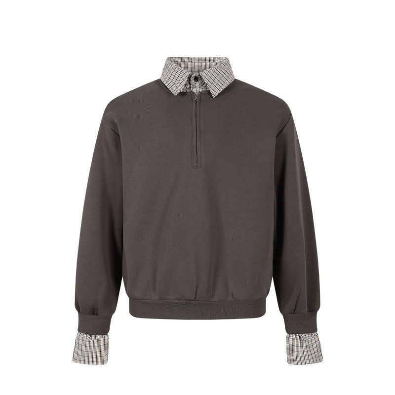 Front view of dark brown half-zip pullover with plaid collar and matching plaid cuffs