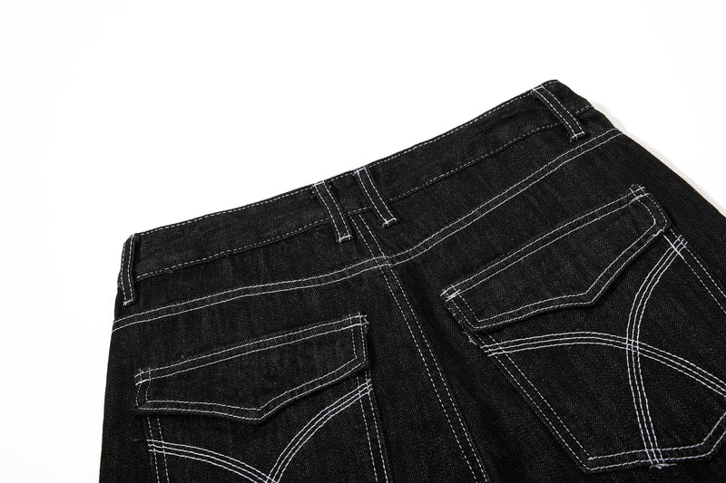 Back view of black denim pants with stitched patch pockets and belt loops