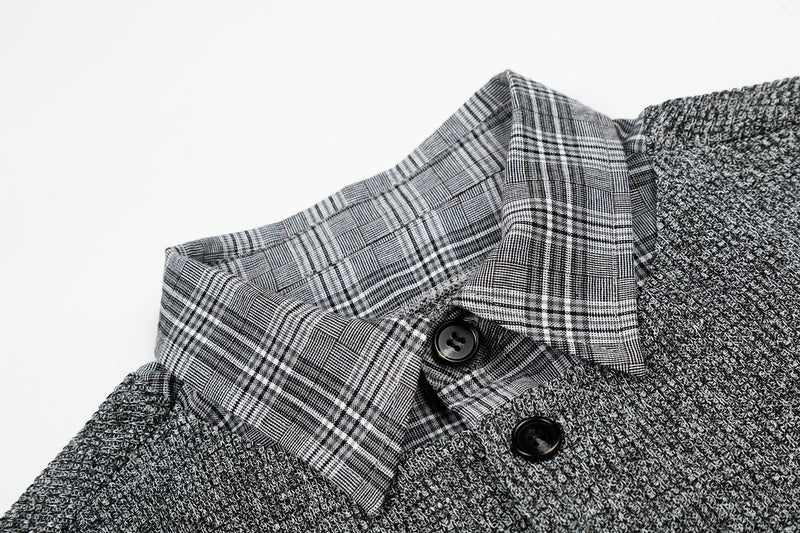 Close-up of a layered gray knit check shirt with plaid collar and black buttons on a white background
