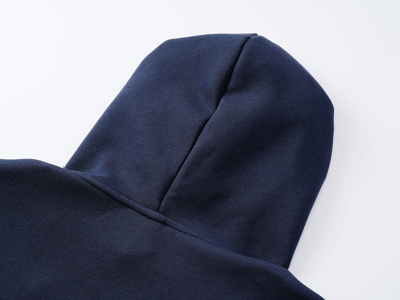 Close-up of navy hoodie hood seam and soft knit fabric texture