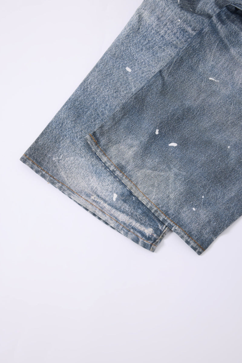 Hem close-up of light wash wide-leg jeans with distressed finish