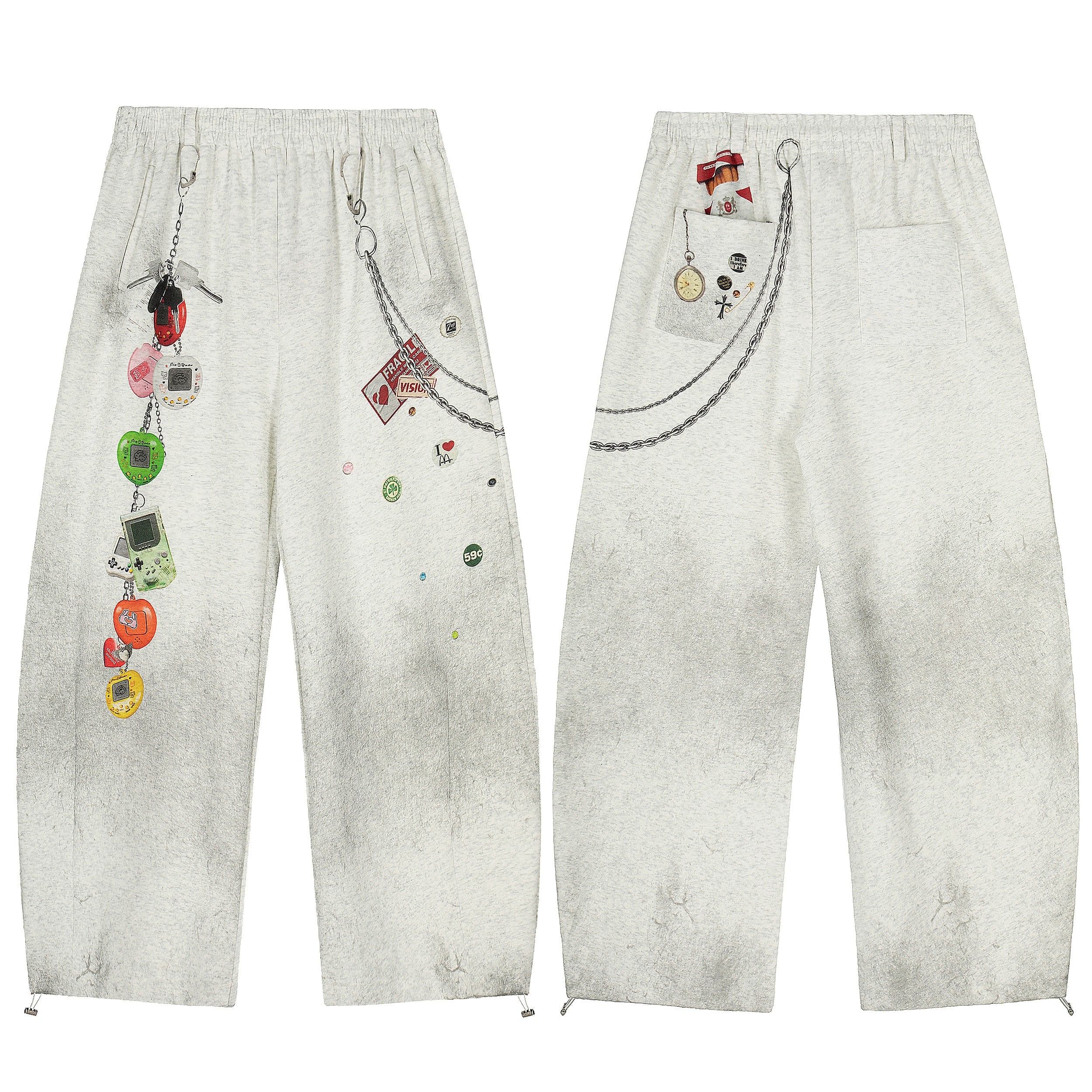 Light grey sweatpants with Y2K retro gadget chain print, Tamagotchi charms, Game Boy graphic and scattered pin badge details