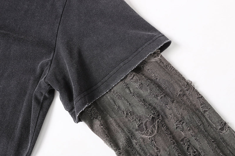 Close-up of short sleeve hem over camo mesh long sleeve