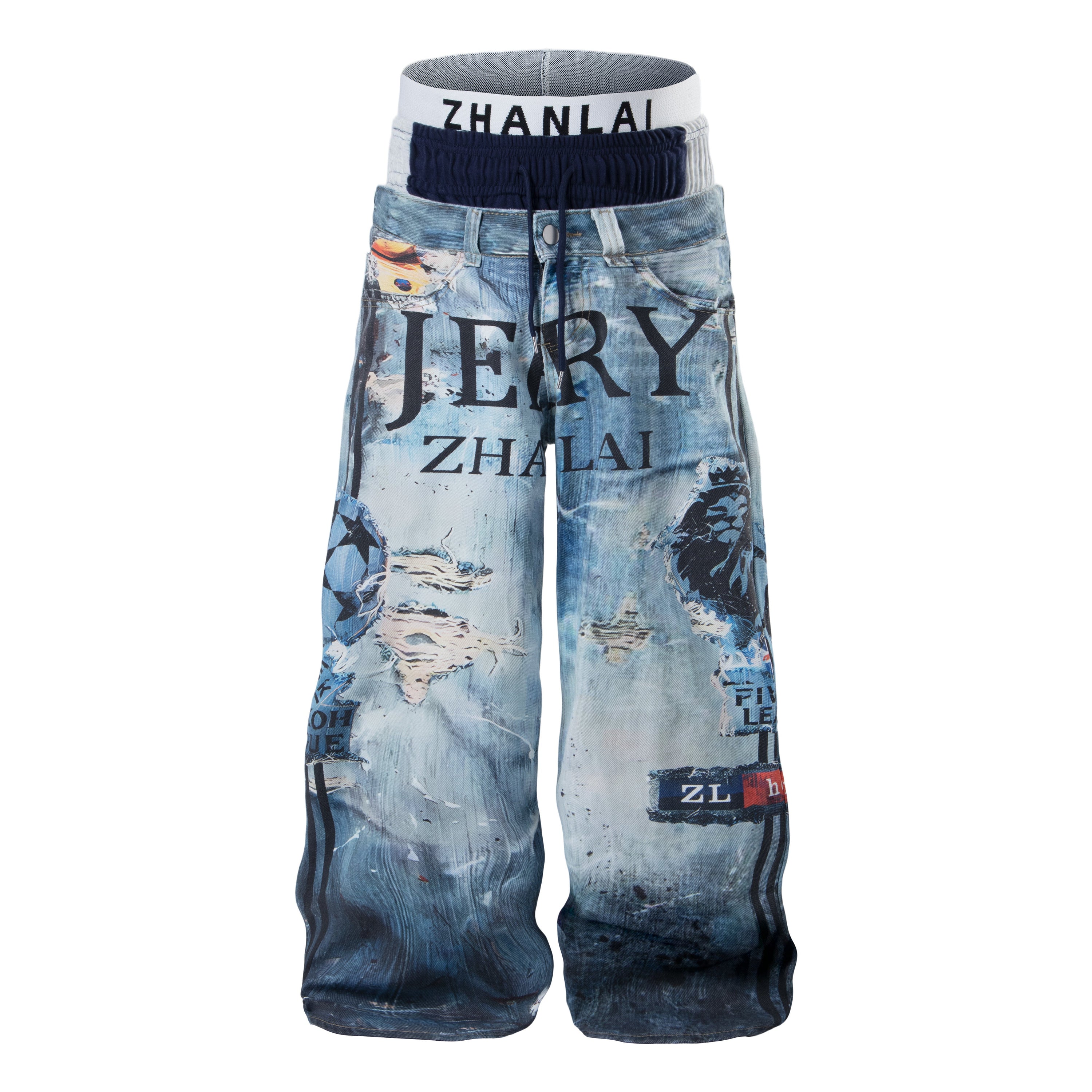 Front view of wide-leg graphic denim pants with layered waistband, distressed print, and lion motif in washed blue