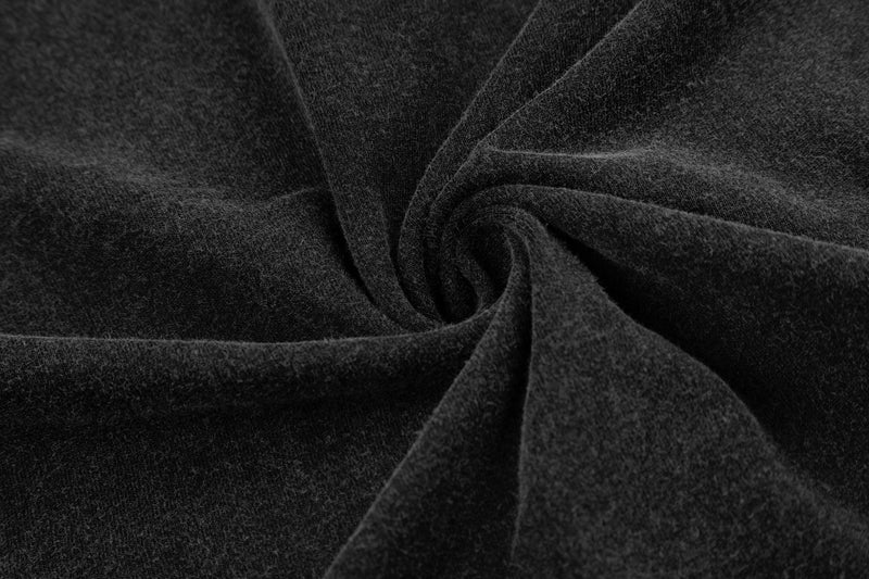 Close-up of black washed cotton fabric with a soft vintage texture and twisted folds for a streetwear tee