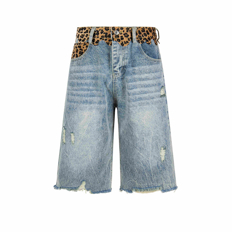 Front view of light wash distressed denim shorts with leopard print waistband and frayed hems