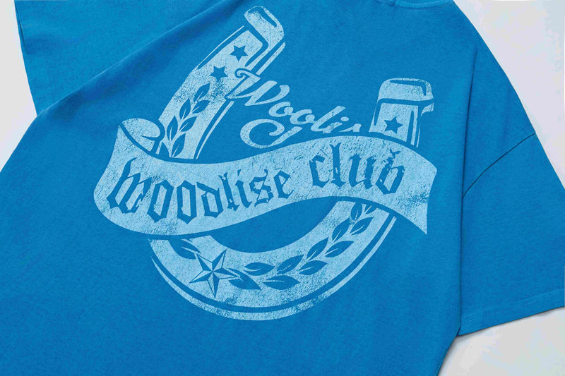 Blue oversized cotton tee with vintage-style star and bottle graphic reading coolish brookhouse club