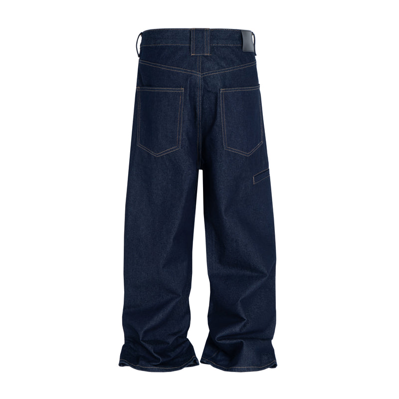 Back view of raw indigo barrel fit jeans with curved seam details and wide legs