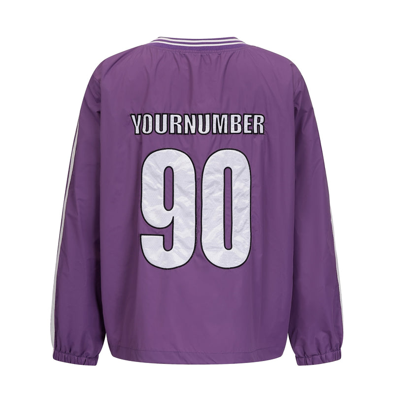 Back of purple nylon pullover with YOURNUMBER 90 graphic and white-trimmed collar