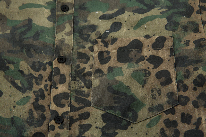 Close-up of chest pocket and button placket on camo leopard shirt