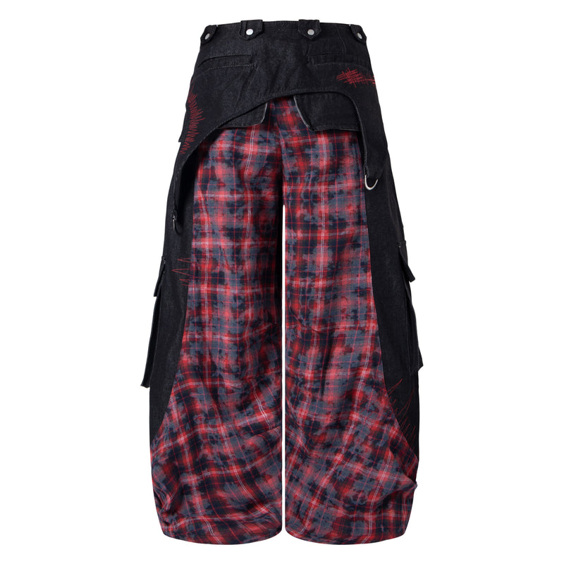 Back view of black wide-leg cargo pants with red plaid panels and layered flap pockets