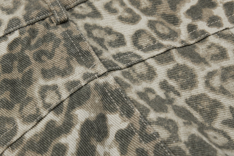 Close-up of stitched panel seams on leopard print barrel leg pants