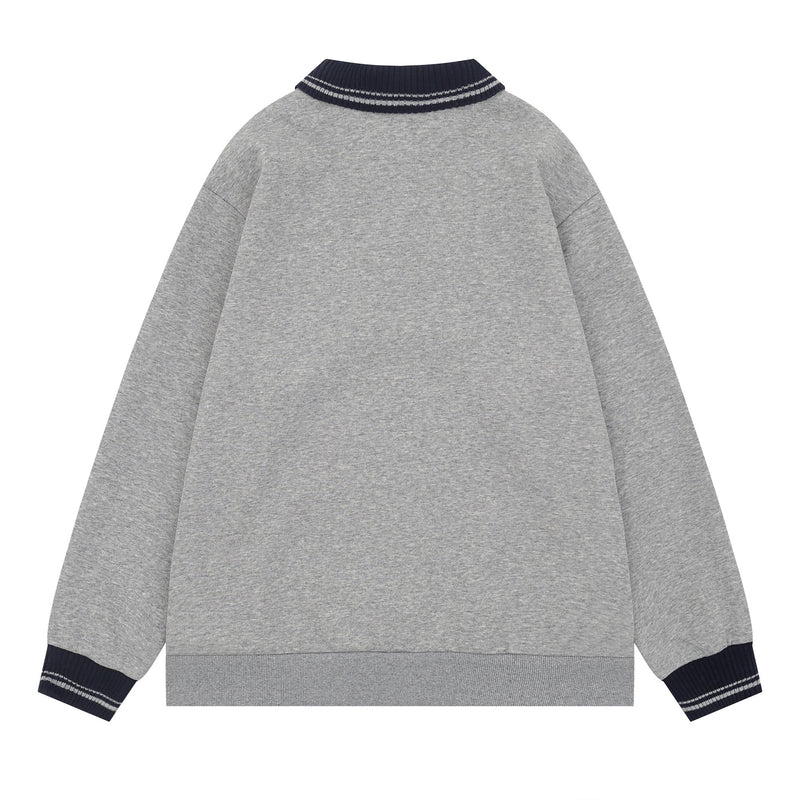 Back view of gray polo sweatshirt with navy striped rib collar and matching cuff trim