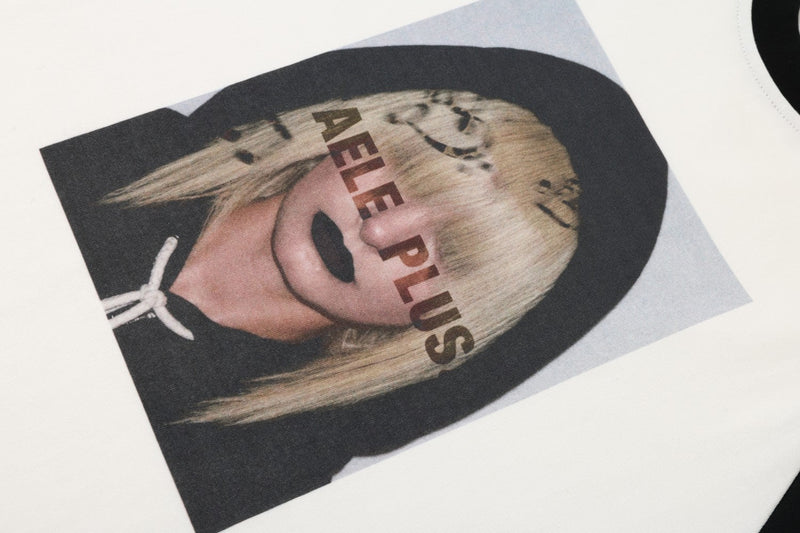Close-up of front graphic portrait print on white raglan tee
