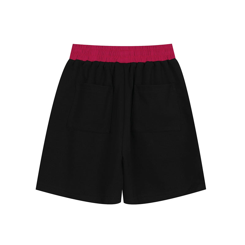 Back view of black sport shorts with magenta waistband and two patch pockets