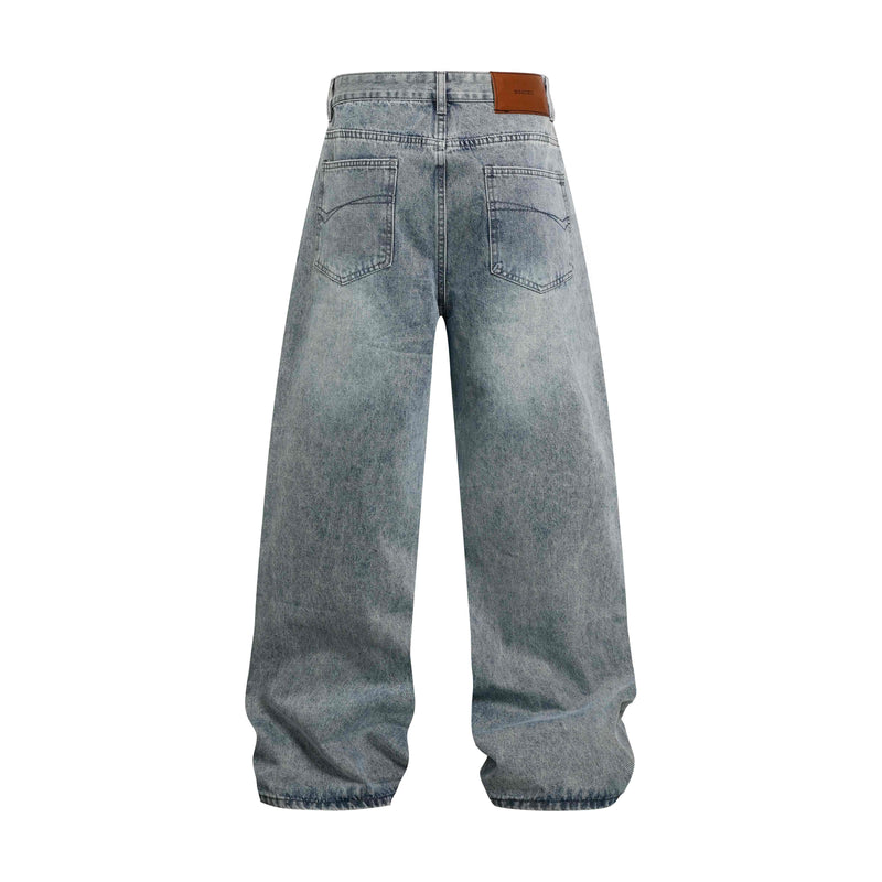 Back view of light wash wide-leg jeans with leather logo patch