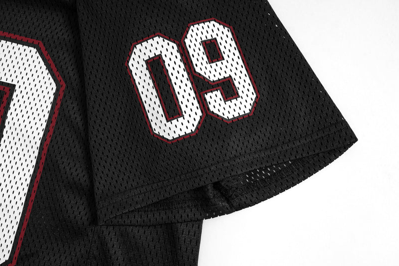 Black mesh football jersey sleeve with white number 09 and red trim, shown on a clean white background