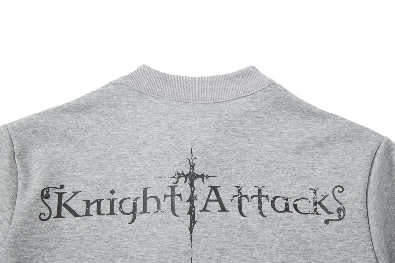 Back view of a gray polo tee with ribbed collar and gothic Knight Attack graphic print on the upper back